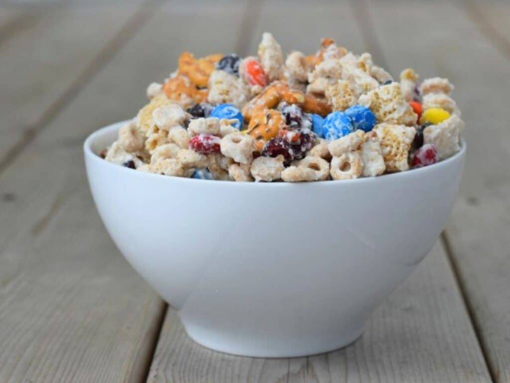 Image shows perfect snack white chocolate party mix.
