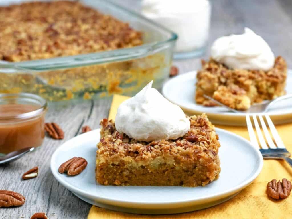 Image shows pumpkin dump cakes served on plates.