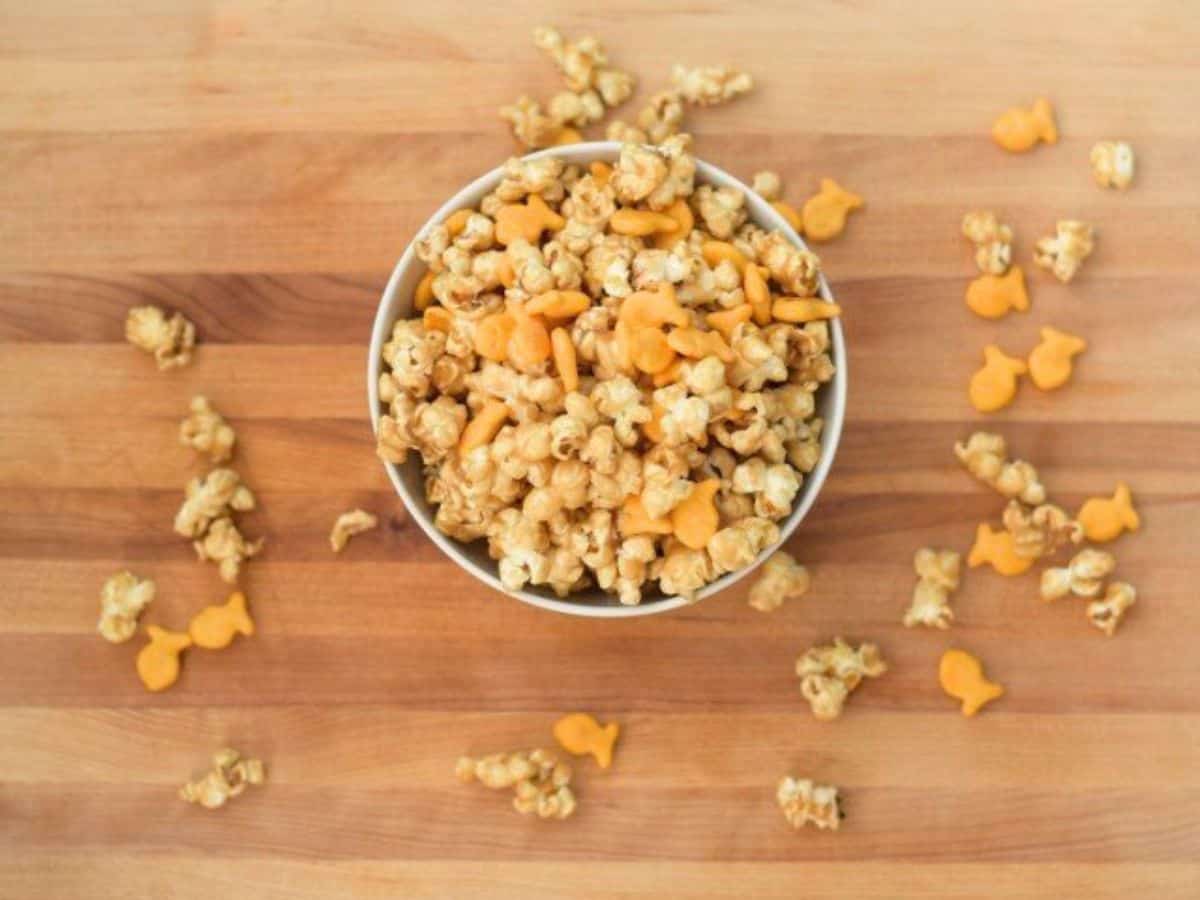 Image shows an overhead shot of Chicago style popcorn mix on a wooden table.