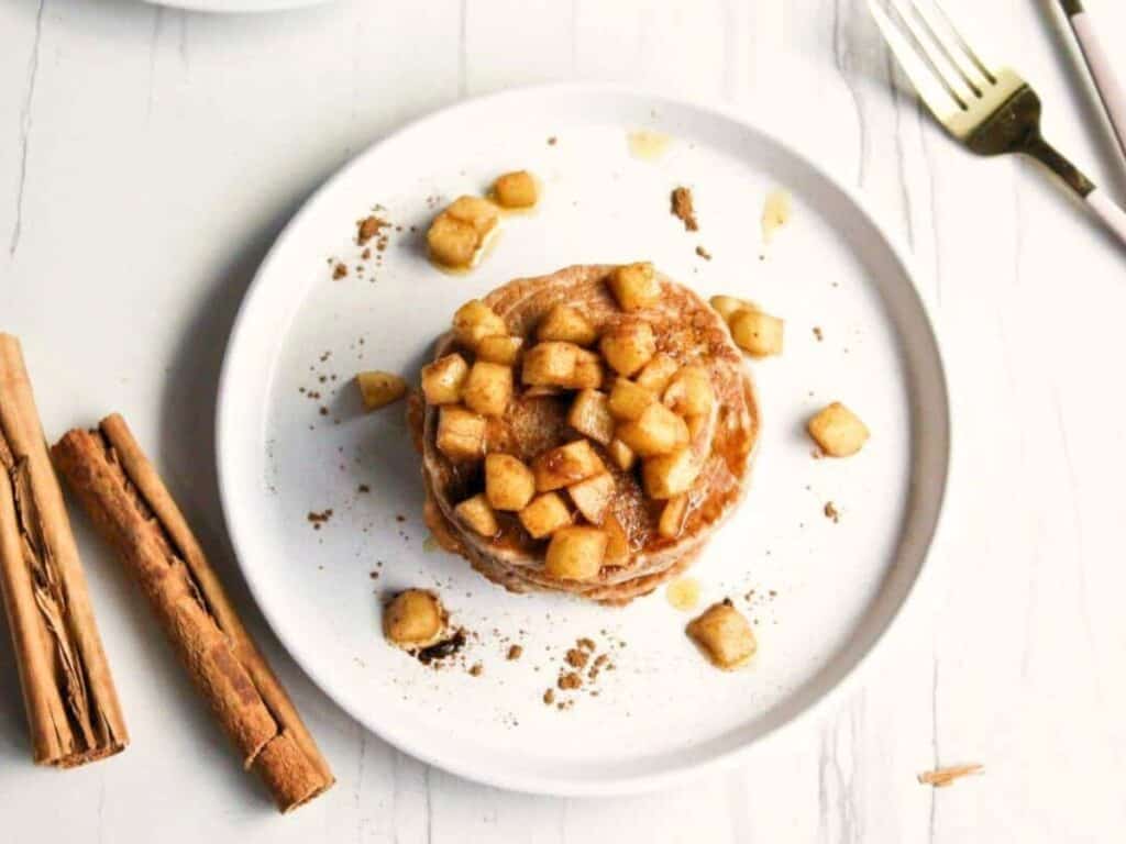 Image shows apple cinnamon pancakes recipe.