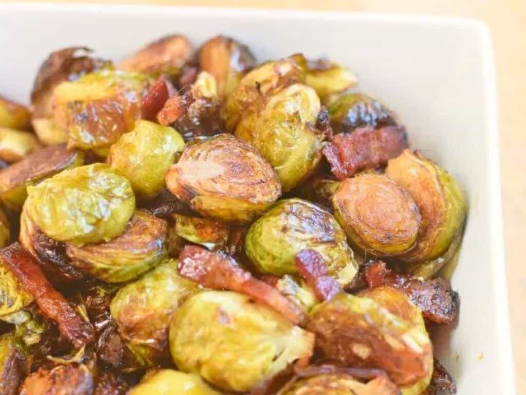Image shows delicious bacon roasted Brussels sprouts.