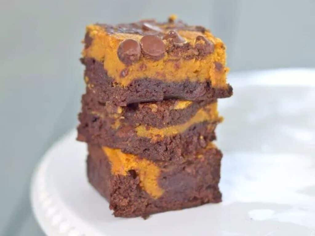 Image shows delicious pumpkin swirl brownies.