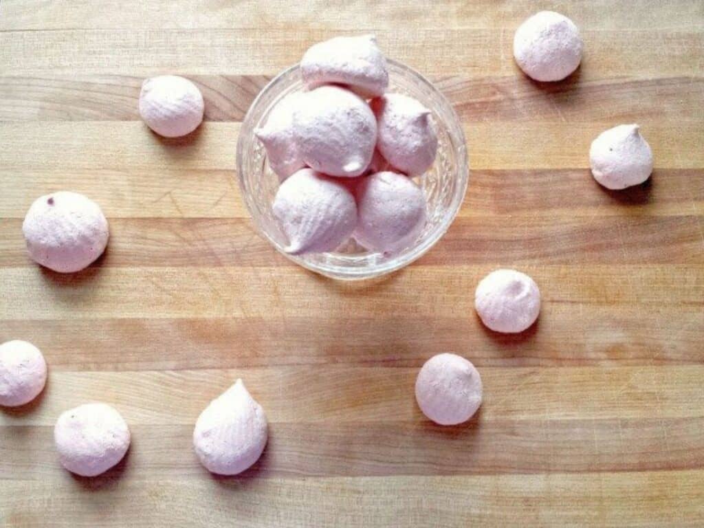 Image shows delicious raspberry meringues.