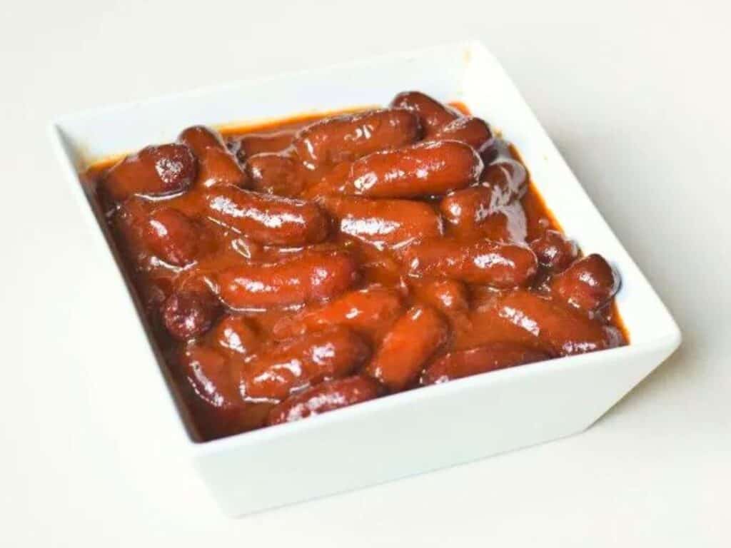 Image shows easy to make BBQ bourbon little smokies.