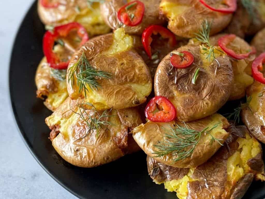 Image shows easy to make air fryer crispy smashed potatoes.