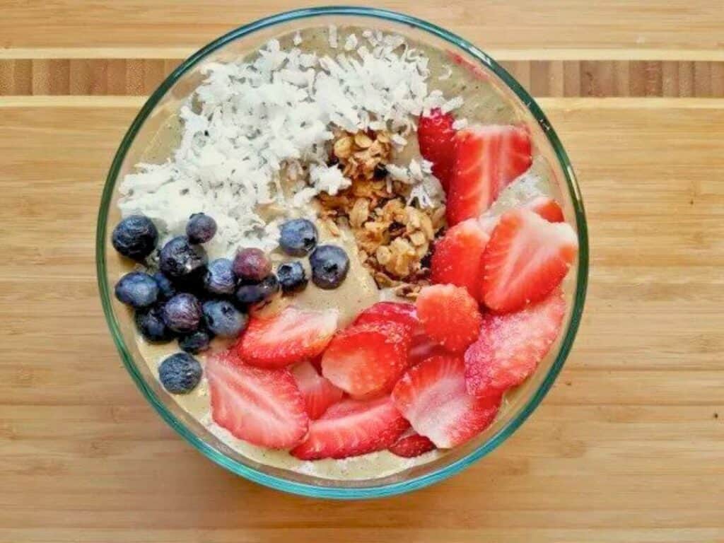 Image shows easy to make red white and blue smoothie bowl.
