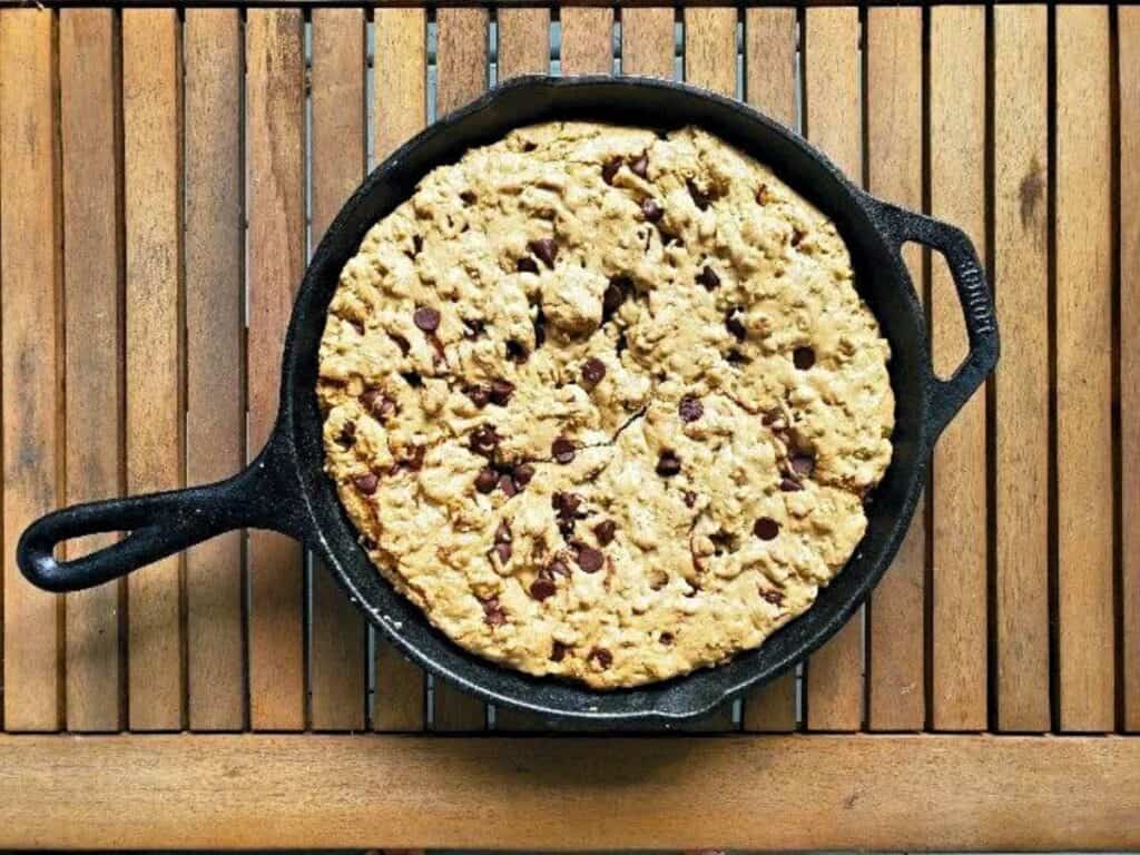Image shows irresistible chocolate chip skillet cookie.