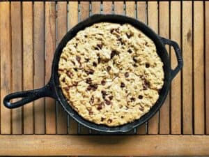 Image shows irresistible chocolate chip skillet cookie.