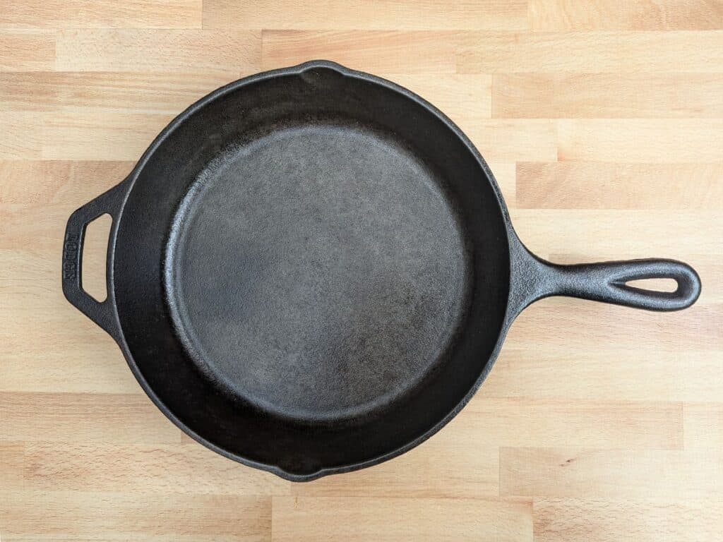 Image shows an Overhead view of cleaned cast iron pan.