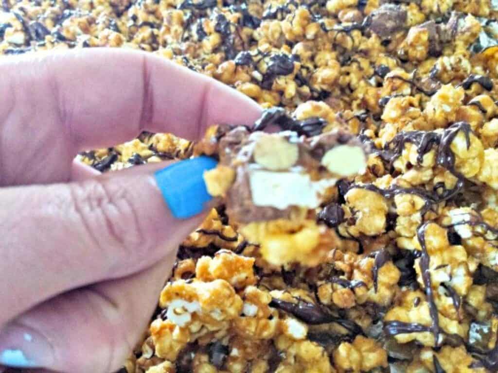 Image shows bite of Snicker popcorn.