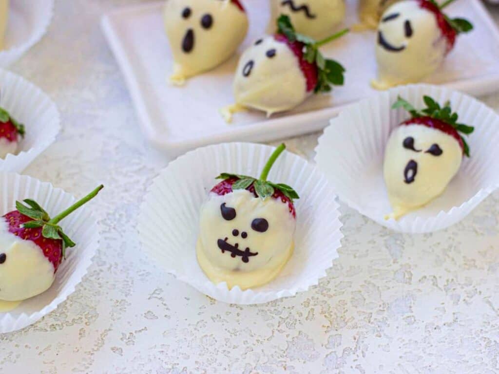 Image shows delicious Halloween chocolate covered strawberries.