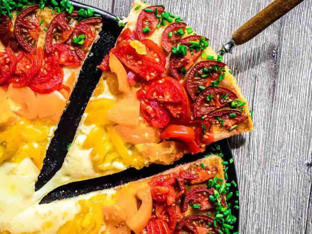 Image shows delicious rainbow fathead pizza.