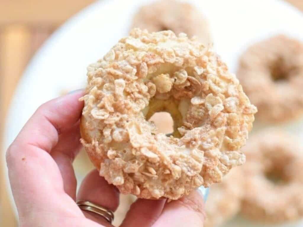 Image shows easy to make cereal topped doughnut.