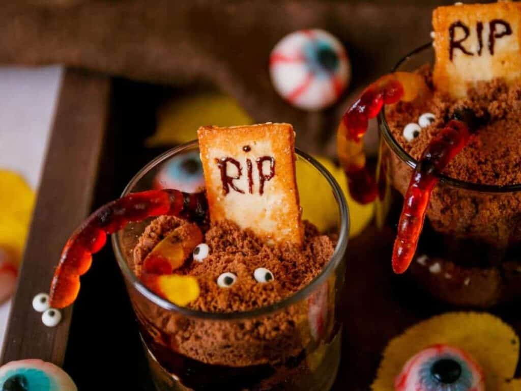Image shows easy to make graveyard dirt cups.