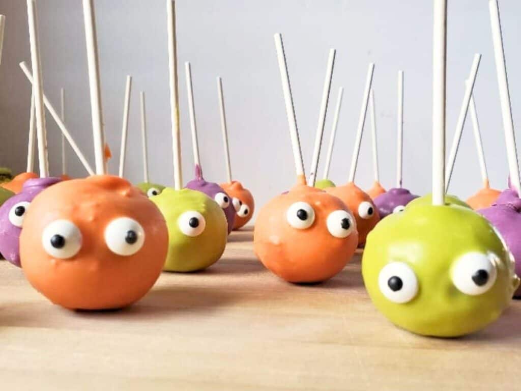 Image shows easy to make monster cake pops on the counter.