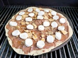 Image shows easy to make smores grilled pizza.