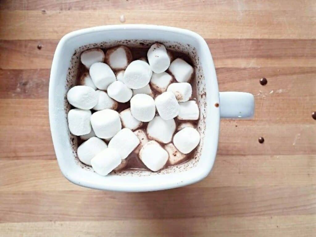 Image shows homemade hot chocolate with marshmallows recipe.