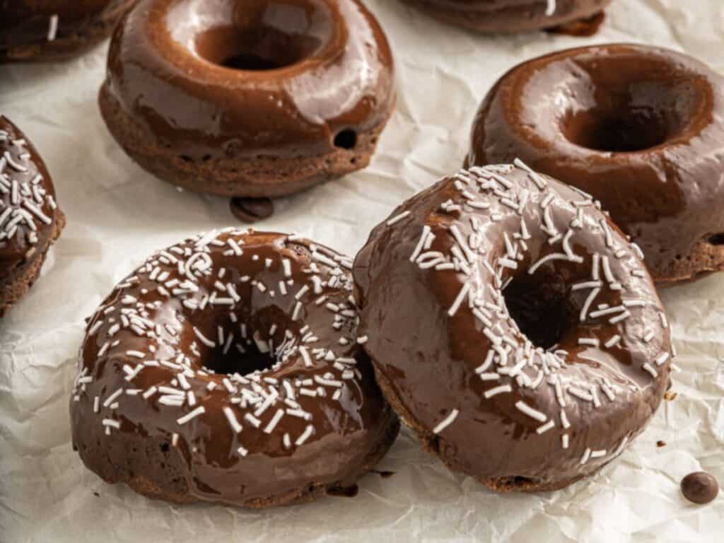 Image shows irresistible vegan chocolate donuts.