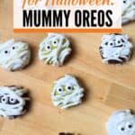 Image shows an Overhead of mummy oreos with text spooky treat for Halloween: mummy oreos.