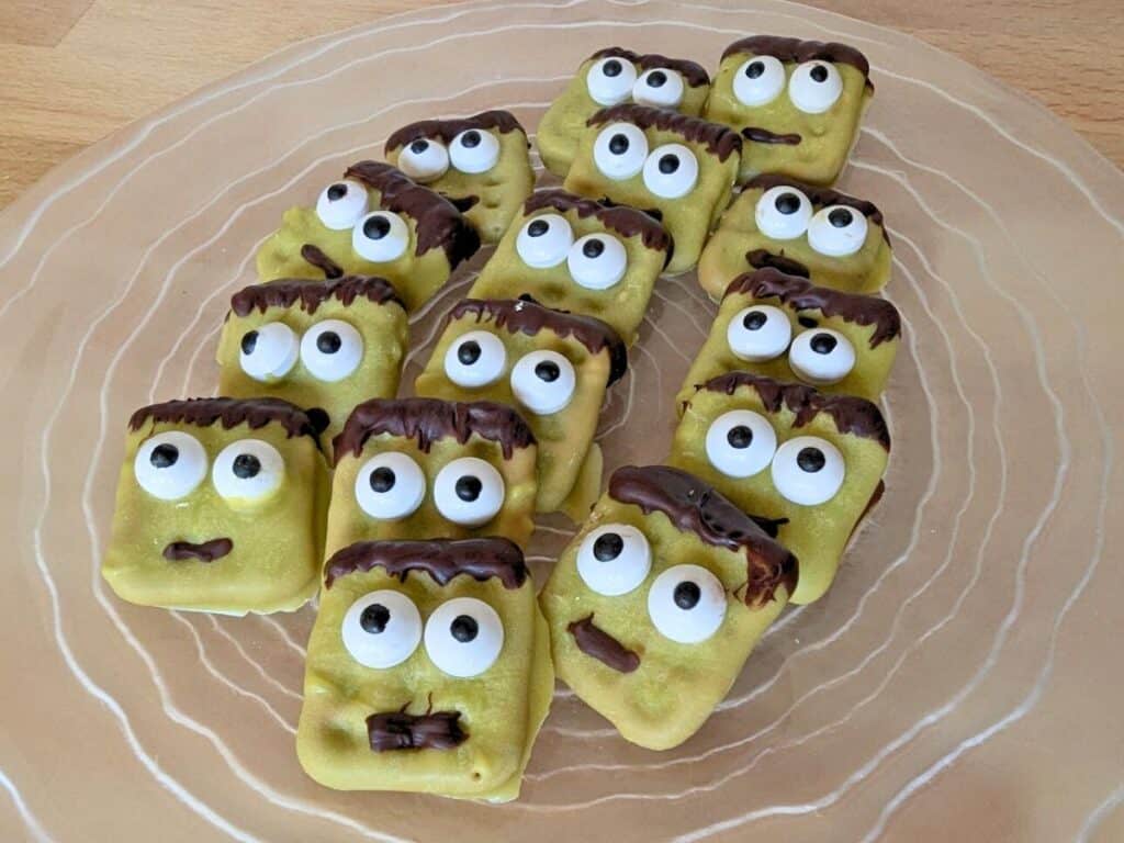 Image shows a Plate filled with Hallowen Frankenstein pretzels.