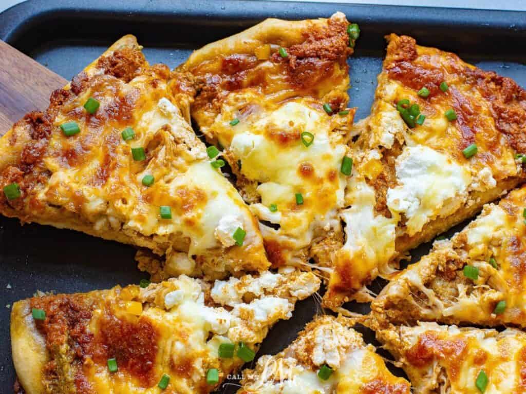 Image shows two pesto chicken pizza recipe.