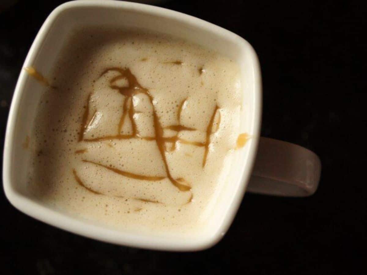 Image shows an overhead closeup shot of a mug with a Copycat Caramel Macchiato.