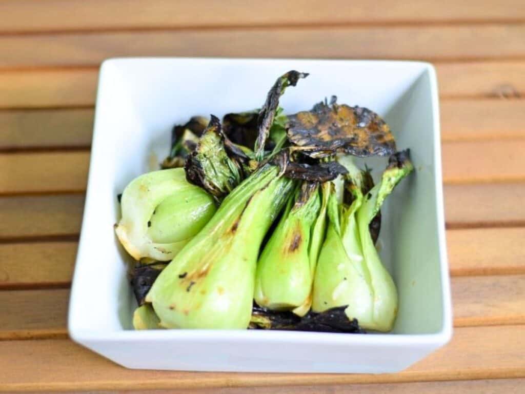 Image shows delicious grilled baby bok choy.