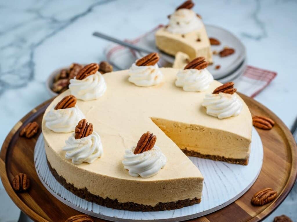 Image shows irresistible no bake pumpkin cheesecake.