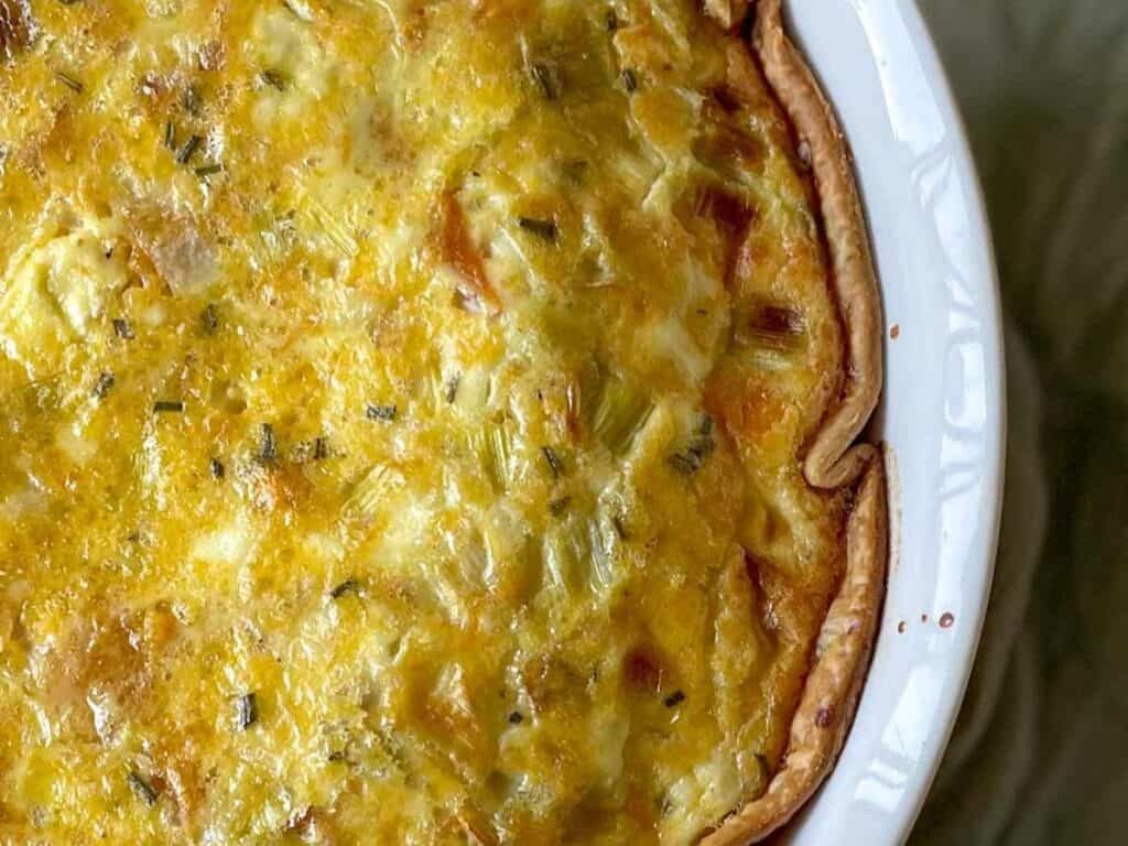 Image shows delicious leek and squash quiche.