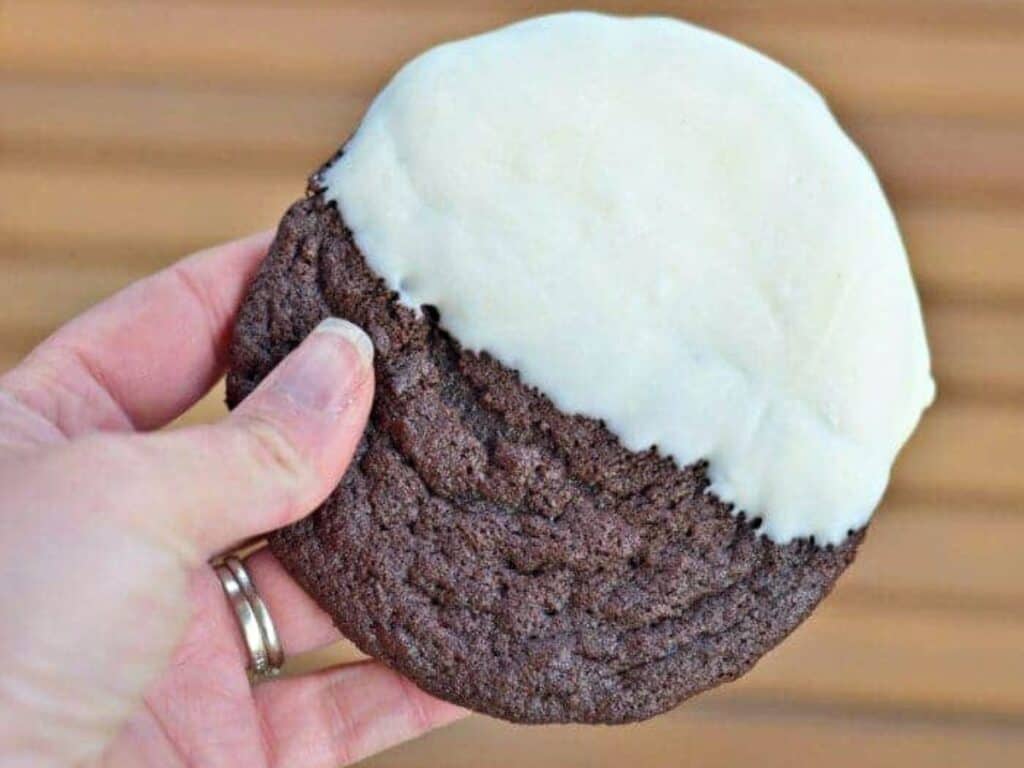 Image shows delicious triple chocolate dipped cookie.