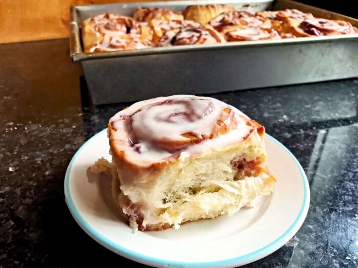 Image shows irresistible cherry cinnamon roll.