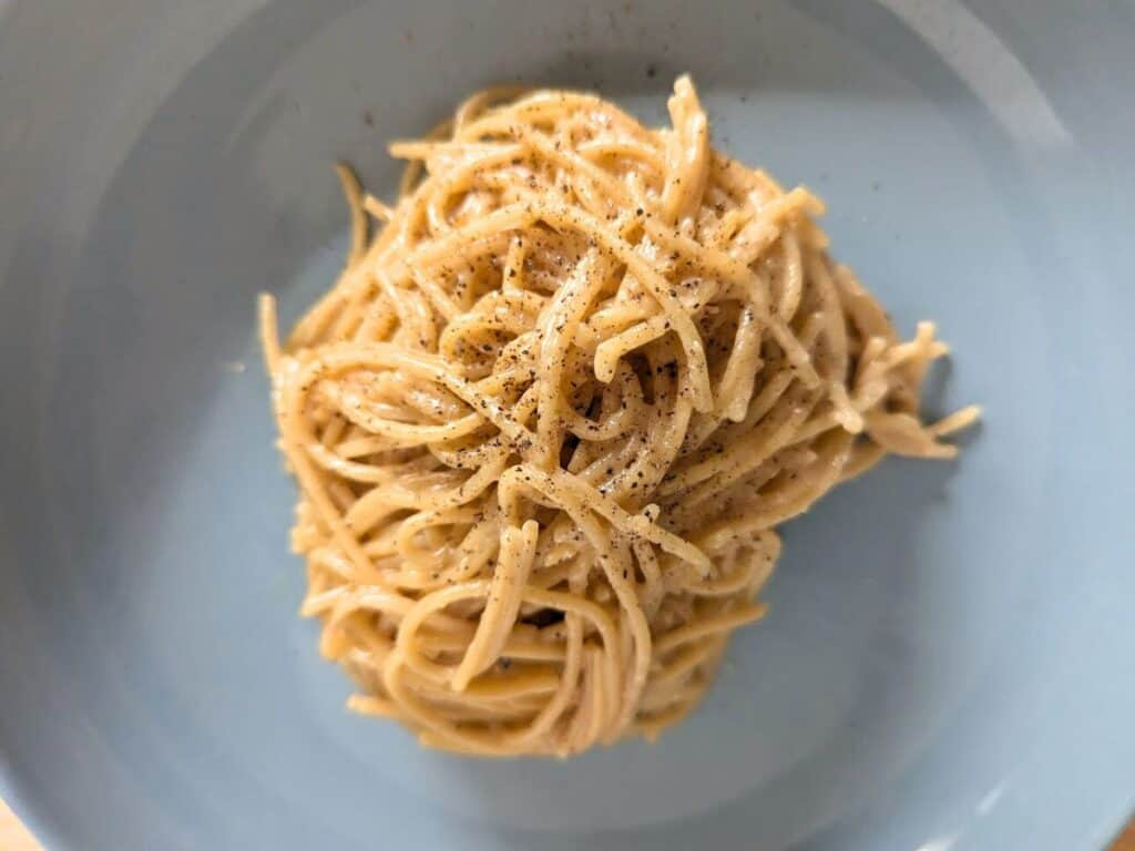 Image shows overhead of cooked lemon butter pasta.