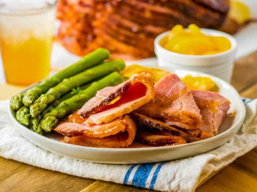 Image shows yummy crock pot spiral ham.
