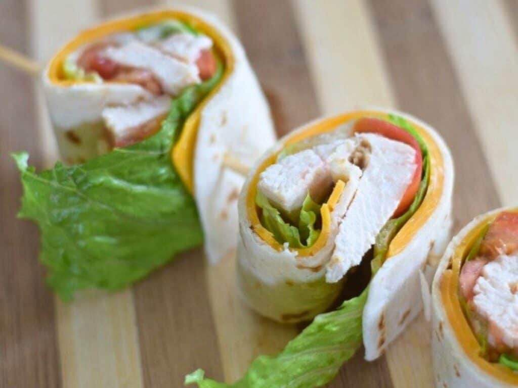 Image shows yummy pinwheel chicken taco wraps.