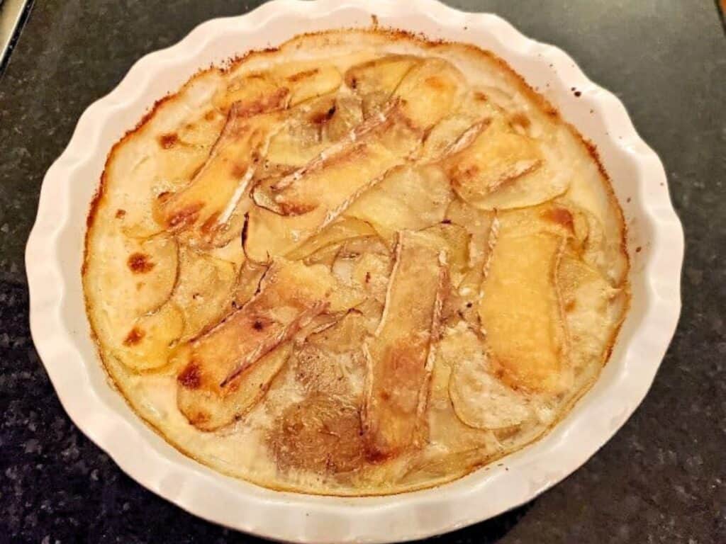 Image shows yummy smoked brie potato gratin.