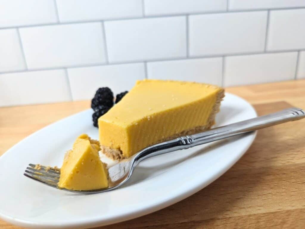 Image shows bite of delicious mango pie.