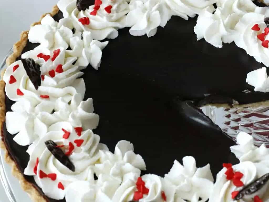 Image shows close-up of yummy chocolate ganache tart.