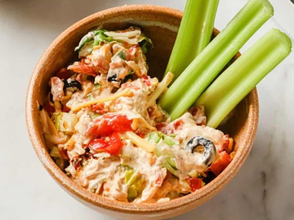 Image shows delicious taco dip with cream cheese.