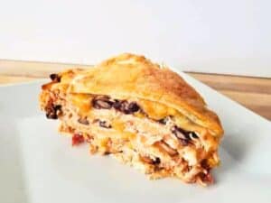 Image shows slice of irresistible Southwest tortilla pie.