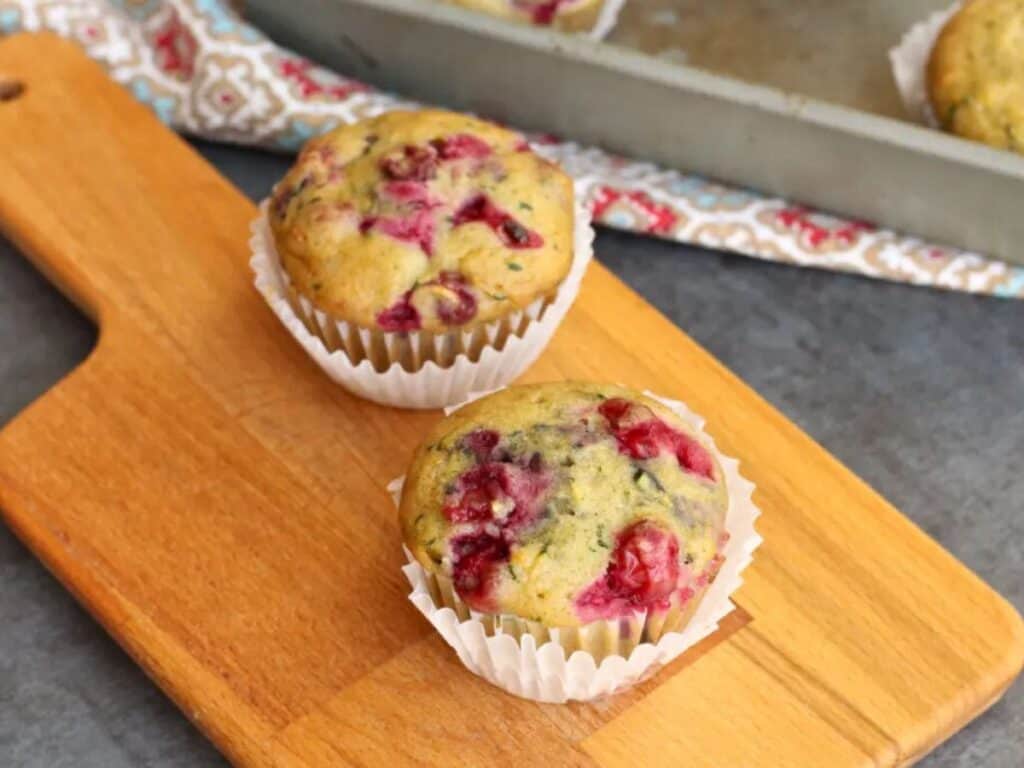 Image shows cranberry zucchini muffins recipe.