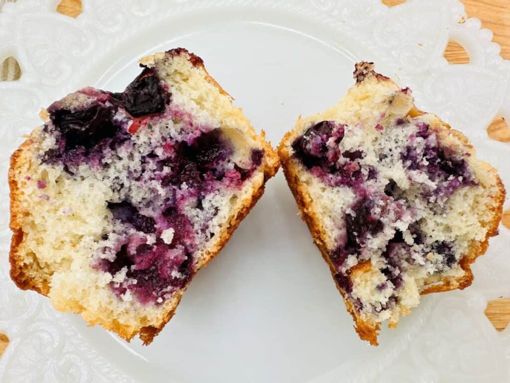 Image shows delicious blueberry buttermilk muffin.
