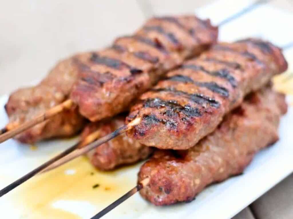 Image shows delicious homemade kefta kebabs.