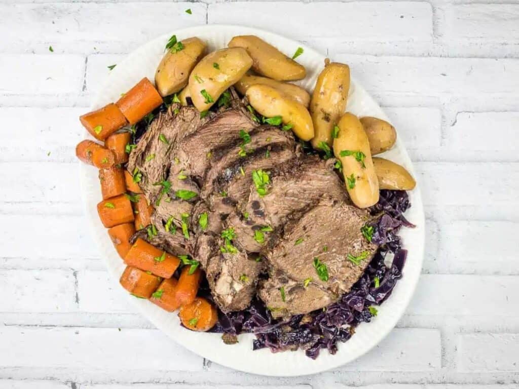 Image shows delicious slow cooker German pot roast.