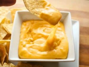 Image shows easy to make gooey nacho cheese sauce.
