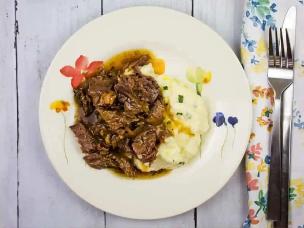 Image shows easy to make pot roast with bacon.