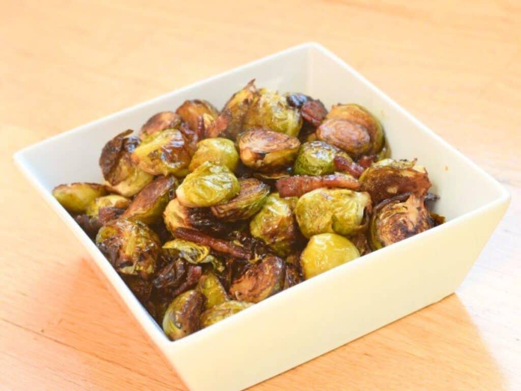 Image shows irresistible bacon roasted Brussels sprouts.