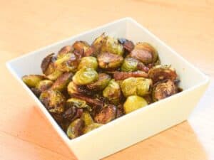 Image shows irresistible bacon roasted Brussels sprouts.
