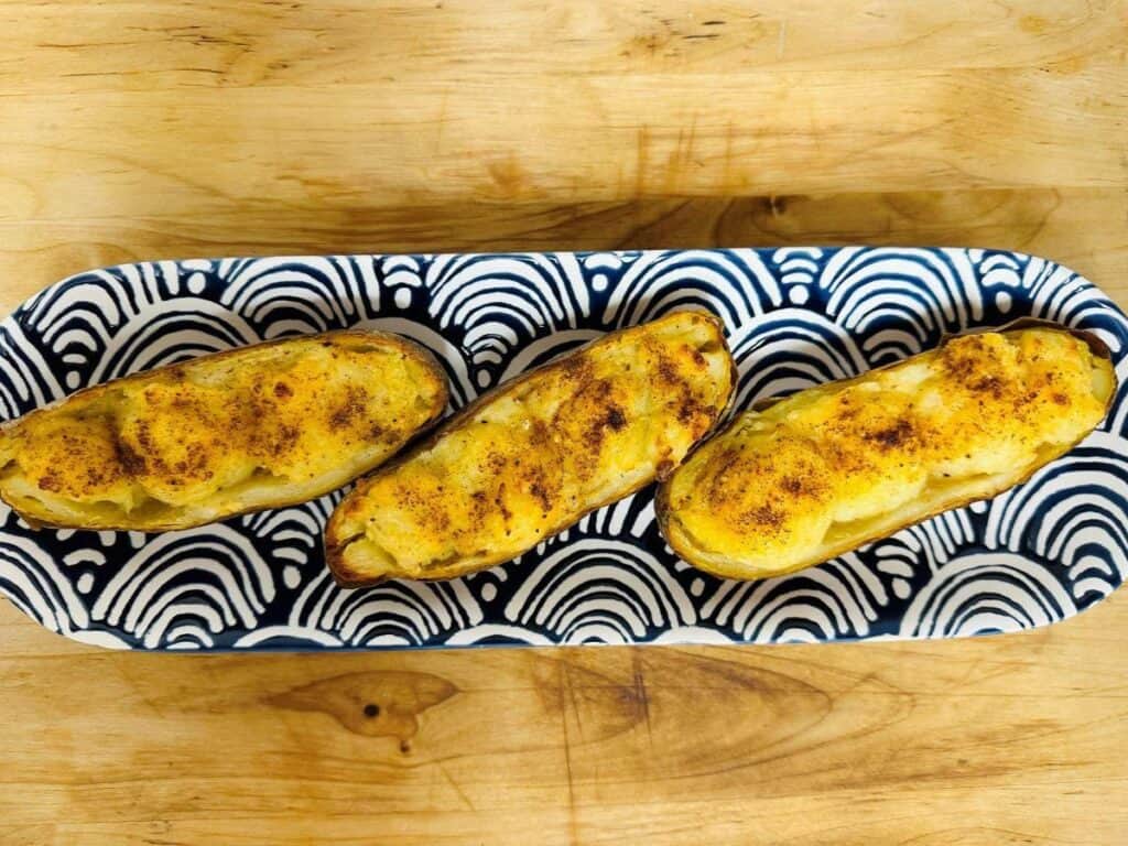 Image shows stuffed baked potatoes recipe.