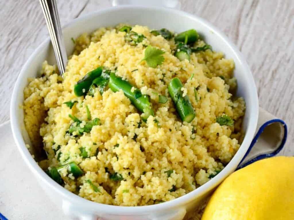 Image shows delicious citrus asparagus couscous.