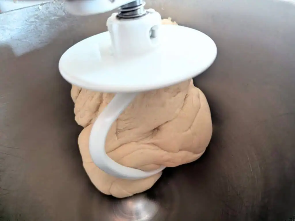 Image shows dough for challah mixed in stand mixer.